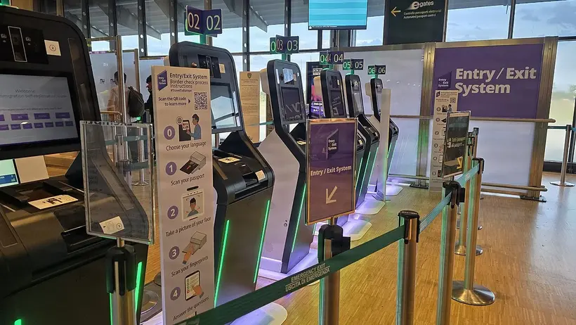 Entry/Exit System self-registration kiosks at a European border: scan the passport, photograph the face, scan four fingerprints. EES replaced passport stamps entirely on 10 April 2026 - photo: Randall Jackson, U.S. Army / public domain