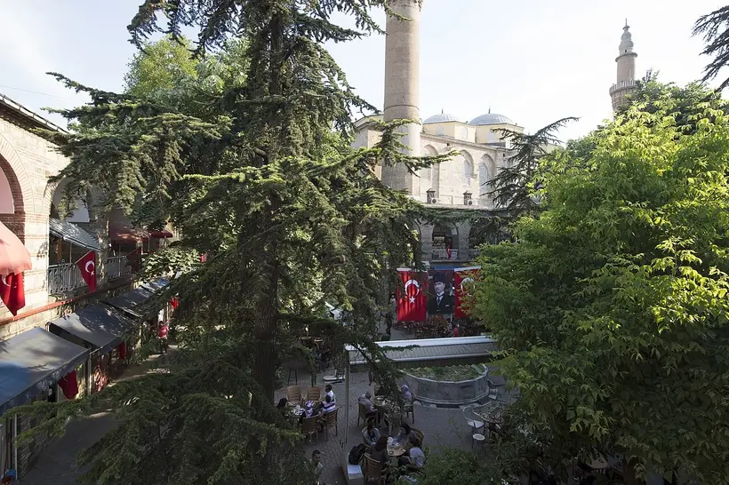 Koza Han in central Bursa, opened in 1491 and still trading silk around its courtyard — photo: Dosseman / Wikimedia Commons, CC BY-SA 4.0